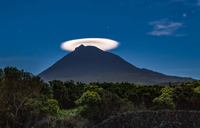 Lenticular cloud on Mount Pico at night